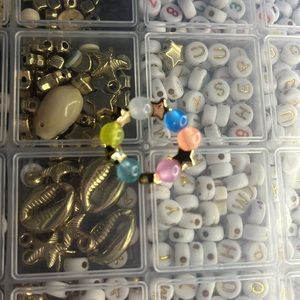 This is a ring with gold stars and beads